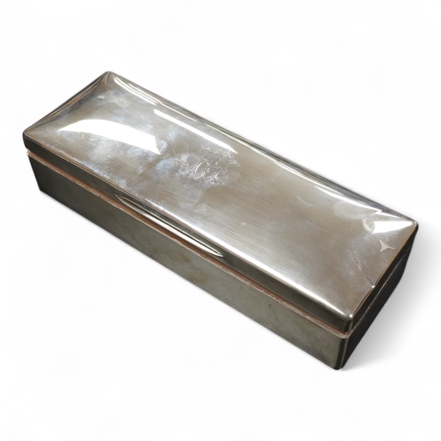 A George V silver table cigarette box length 26cm., gross weight approx. 25.50zt